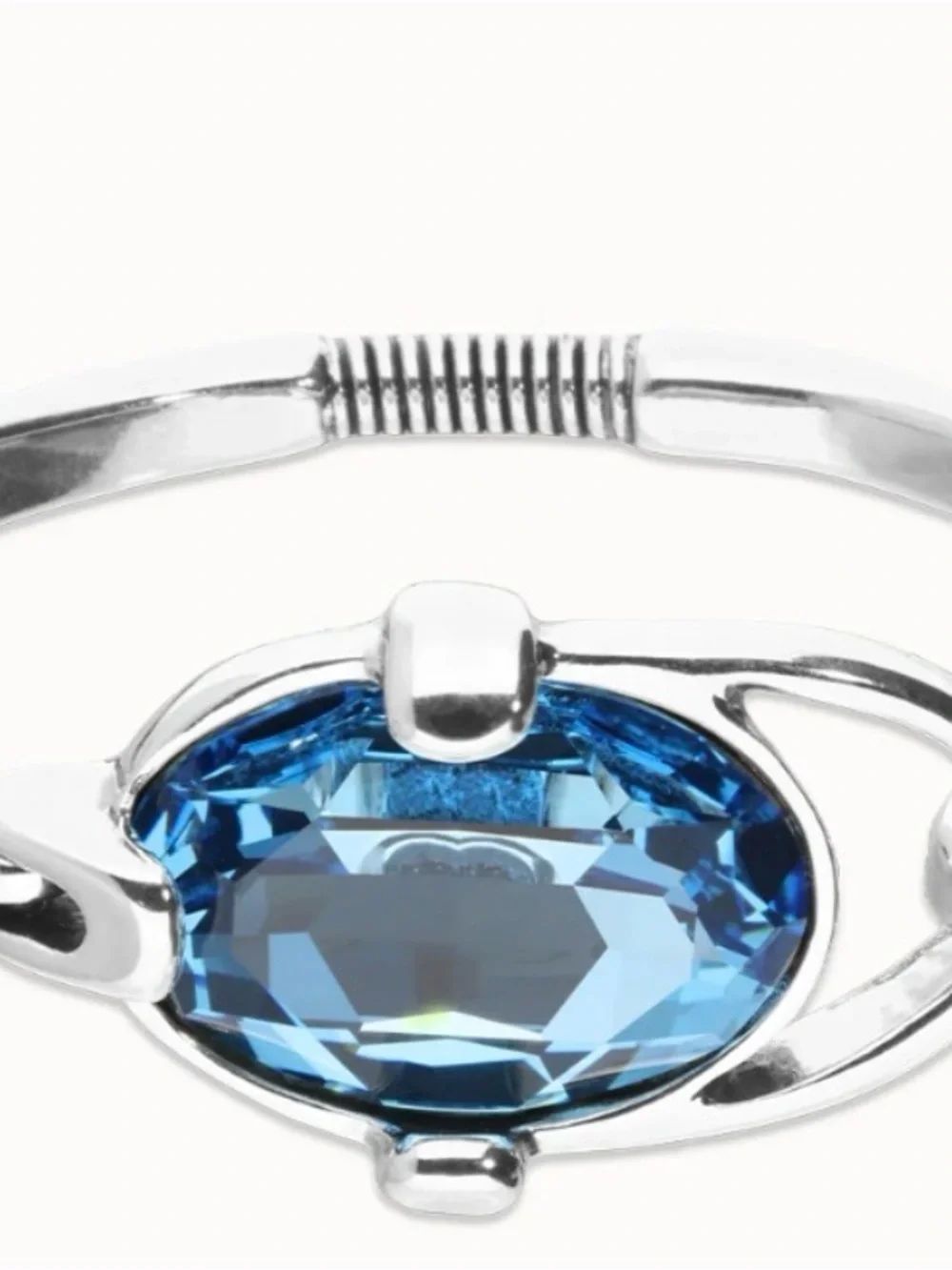 Uno de 50 bangle bracelet with faceted blue crystal